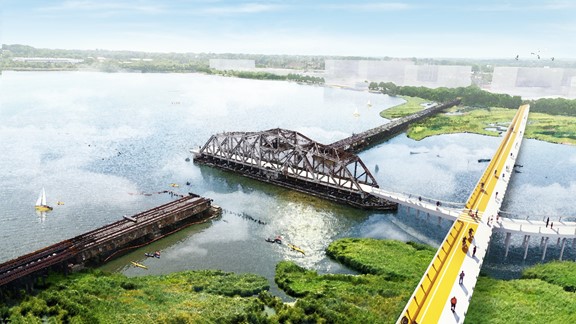 Overhead view of the proposed East to West Pedestrian bridge connecting Westport and Mt. Winans to Port Covington. Part of it connects to the swing bridge, showing exploration by pedestrians. Graphic.